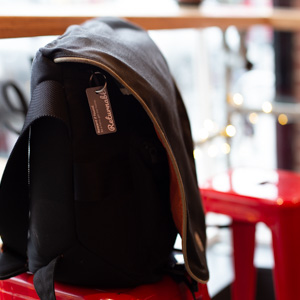 A messenger bag protected by a Returnable tag.